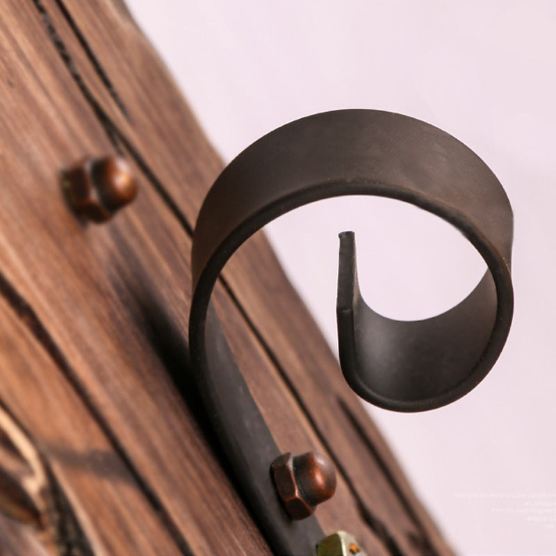 BowLift | A wall lamp with a glass bulb and cylindrical shade made of clear glass, industrial wall lamp for the living room with leaf branch in black