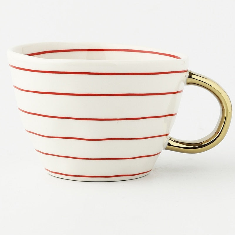 BowLift | Cup with abstract geometric pattern and gold handle
