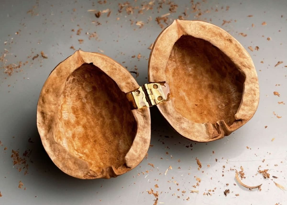 BowLift | Handcrafted dollhouse made from walnut shells with interior light