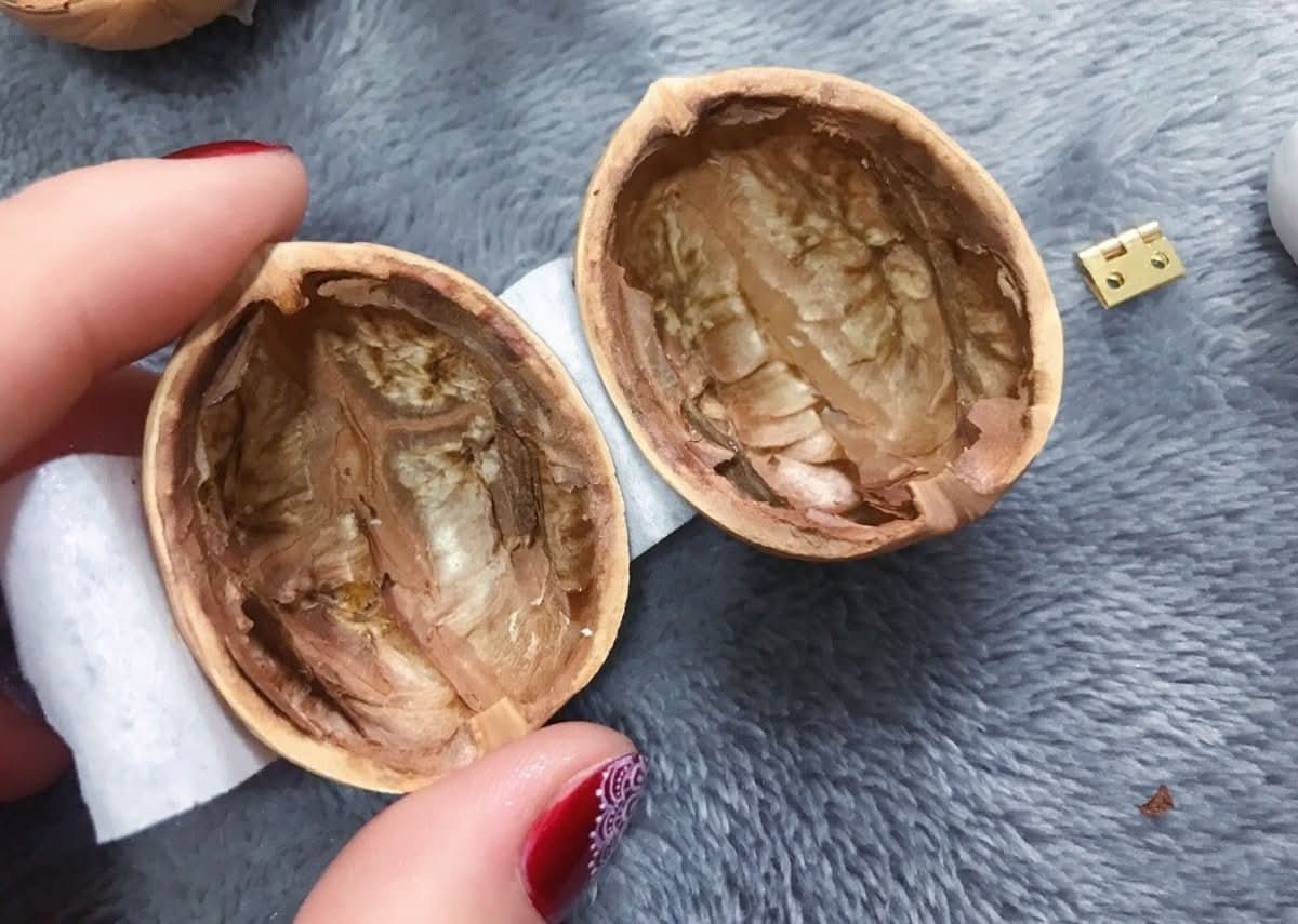 BowLift | Handcrafted dollhouse made from walnut shells with interior light