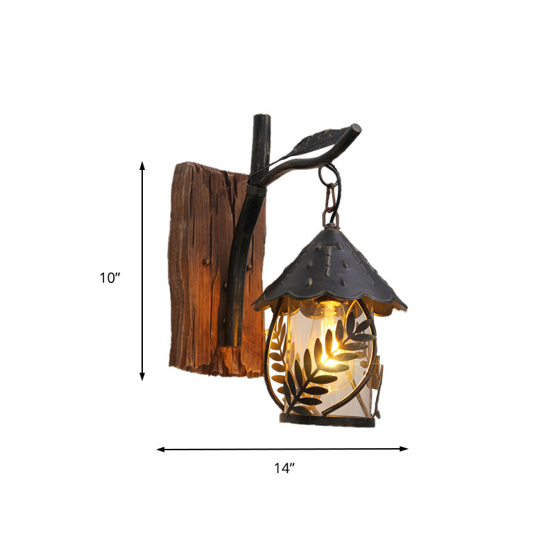 BowLift | A wall lamp with a glass bulb and cylindrical shade made of clear glass, industrial wall lamp for the living room with leaf branch in black