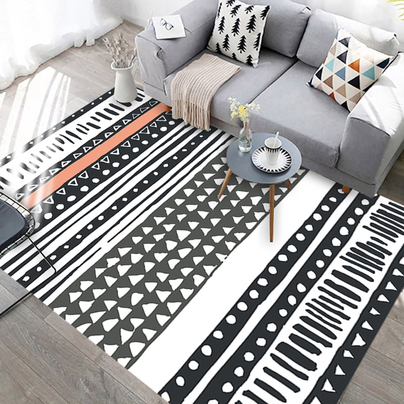 BowLift | Black and white geometric rug with lines and triangles Southwestern pet-friendly area rug for the living room