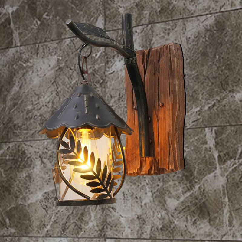 BowLift | A wall lamp with a glass bulb and cylindrical shade made of clear glass, industrial wall lamp for the living room with leaf branch in black