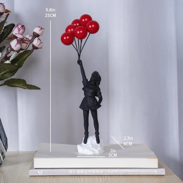 Skulptur eines Mädchen mit Ballon im Banksy-Stil für Tischdekoration und kreative Wohnzimmerdekoration
